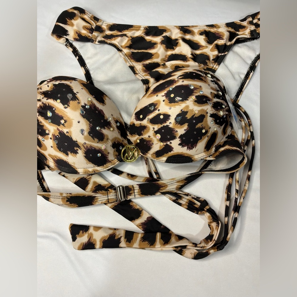 VS Bombshell
Leopard print featuring rhinestone and gold tone logo charm